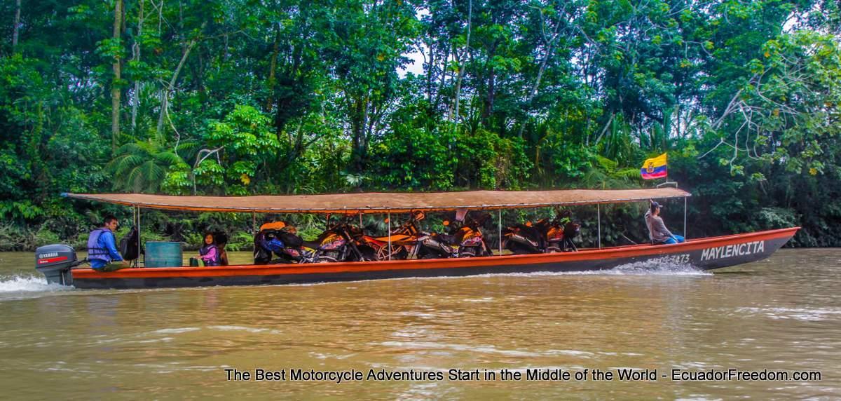 motorcycle traveliung on motorized canoe in ecuador amazon napo river