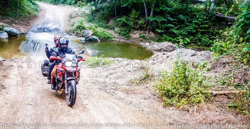 small brook crossing on coastal dirt road in ecuador on bmw f800GS motorcycle adventure tour