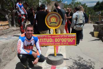 dirt bike rider on the equator in ecuador