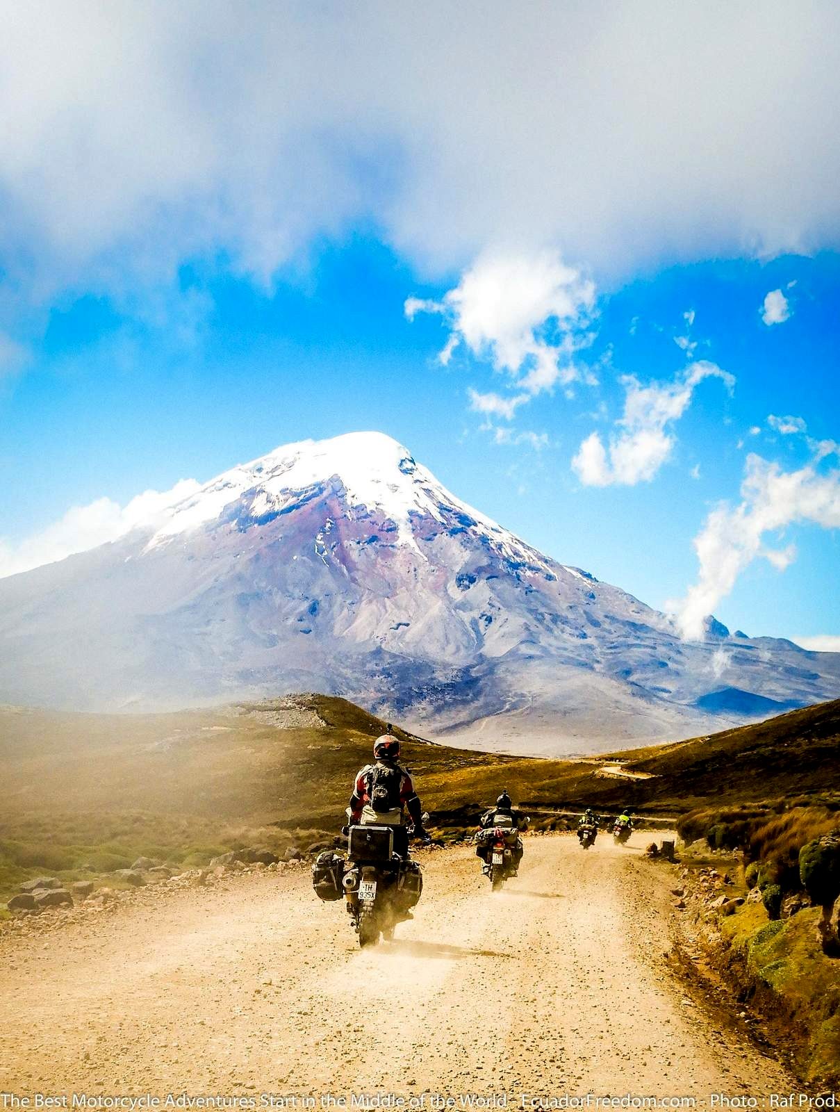 riding dual sport motorcycles towards Chimborazo on a dirt road in Ecuador