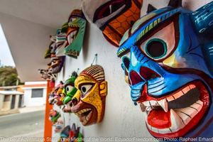 tribal masks in tigua ecuador on motorcycle adventure tour